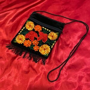 Unused clean, Velvet purse with stitched flower design’s.